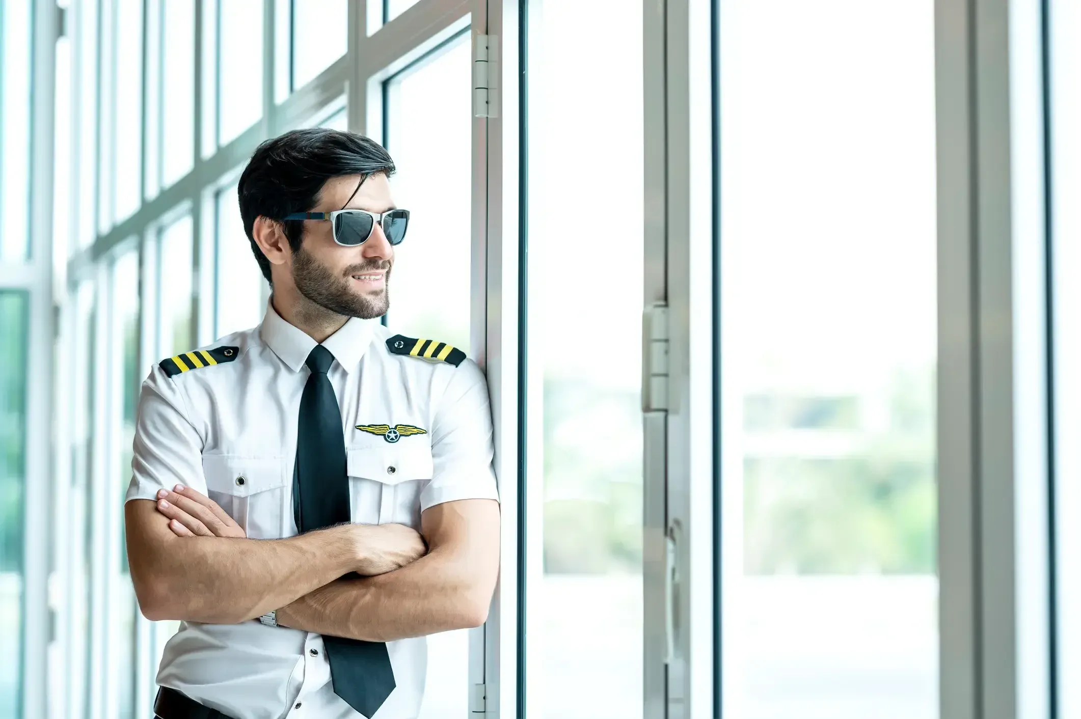 Pilot in uniform representing the long journey through aviation licensing