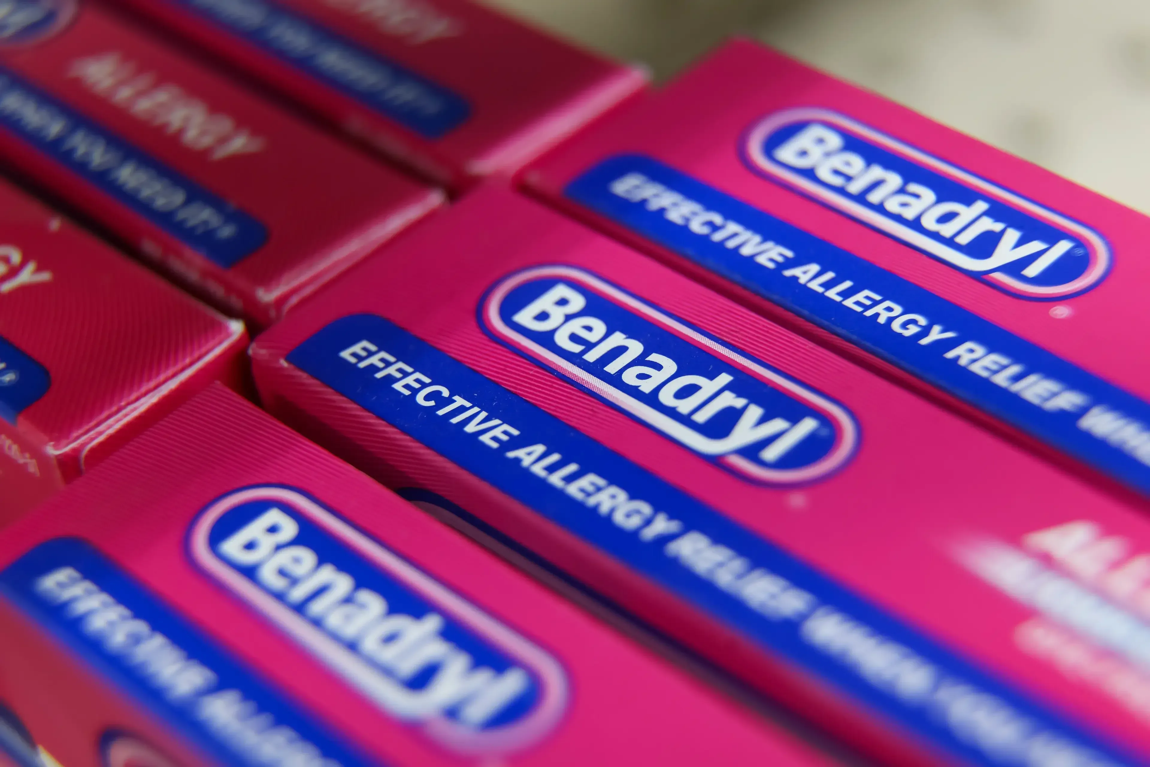 Benadryl sold over the counter in UK pharmacies without age restrictions.