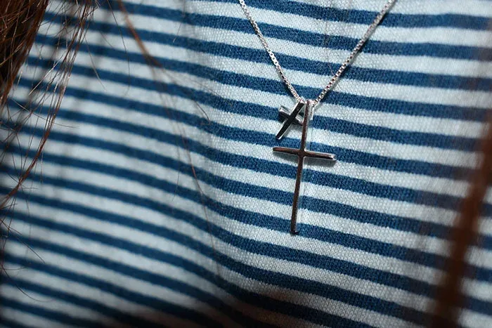 Cross necklaces symbolizing religiously inspired names like reversed 'Heaven'.