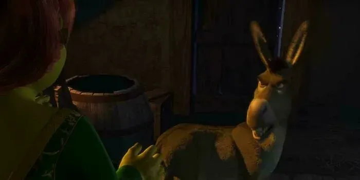 Donkey reacts with horror to Fiona's ogre transformation in Shrek.