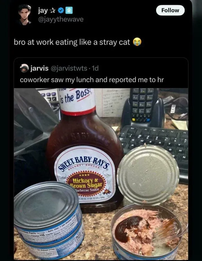 Lunch with canned tuna and barbecue sauce on office desk shown as disgusting dish