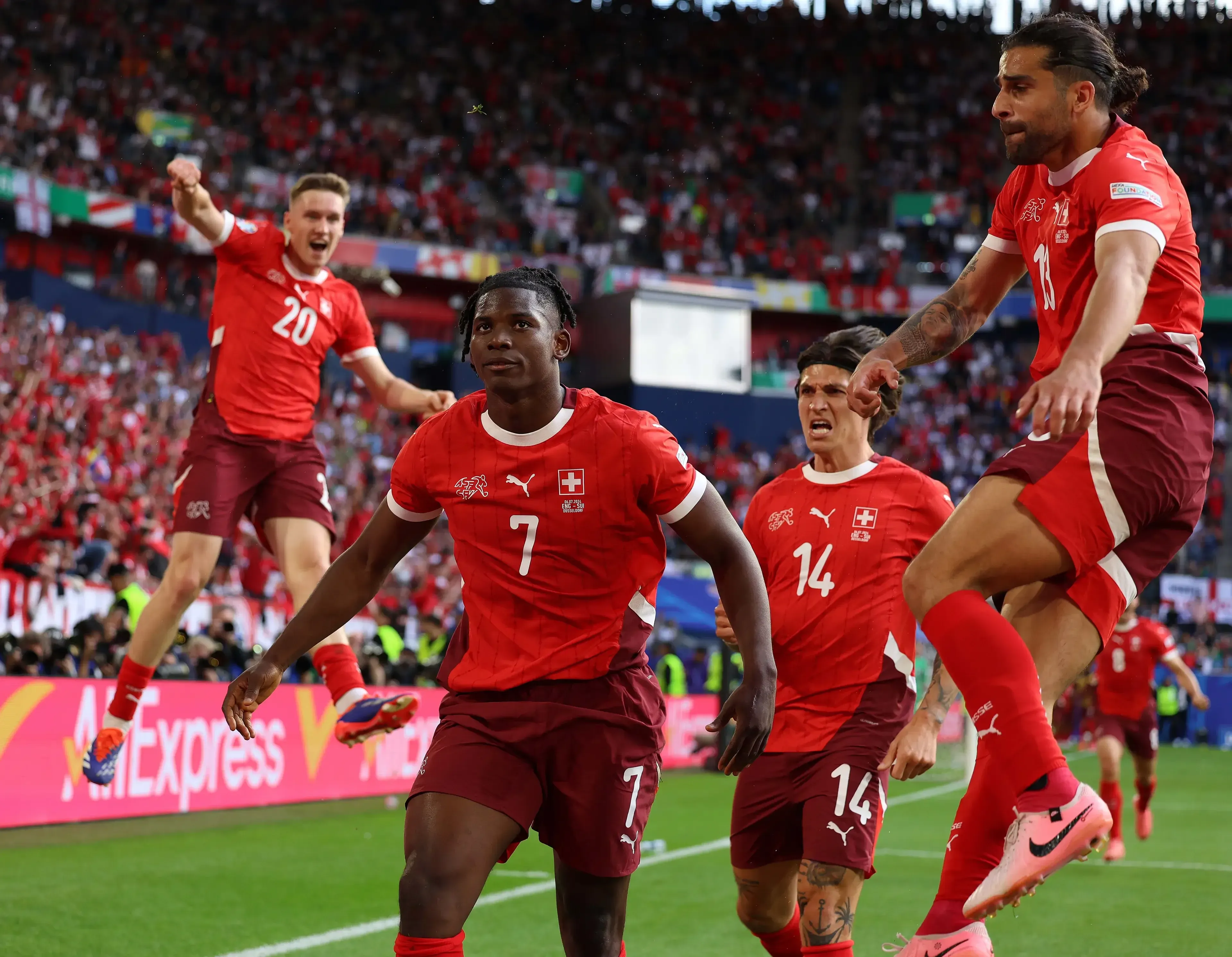Breel Embolo celebrates scoring against England at Dusseldorf Arena in July 2024.