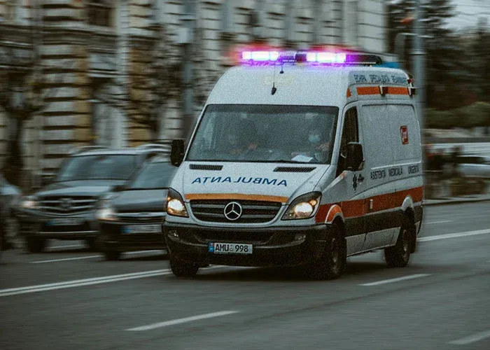 Ambulance rushing through city street during emergency response
