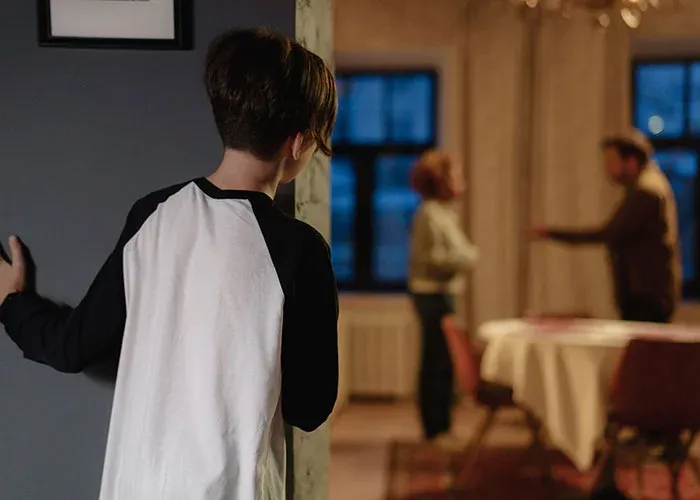 Child witnessing parents arguing during family conflict