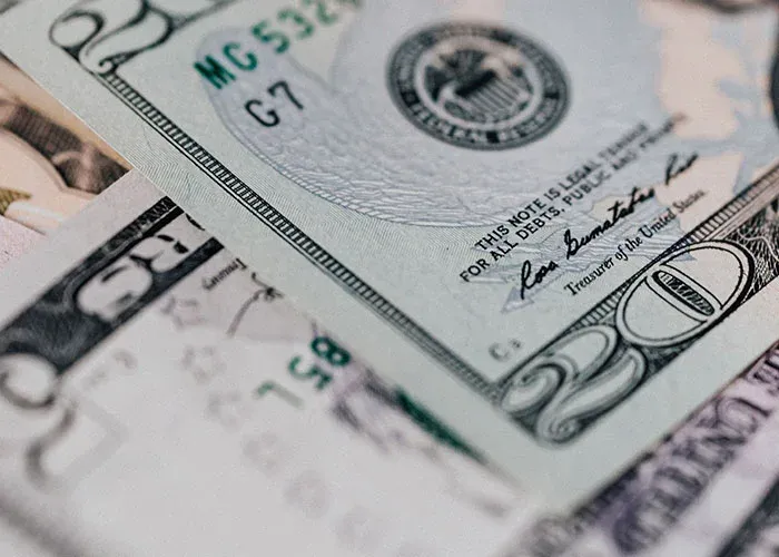 Close-up of dollar bills representing financial mistakes