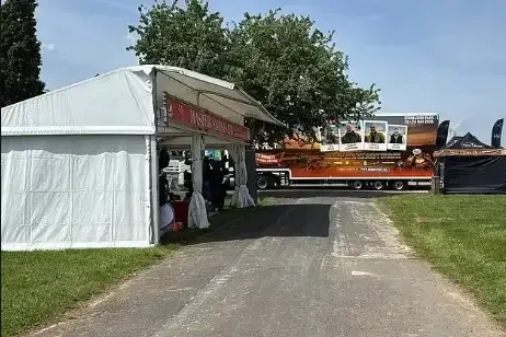 Trader's stall blocked by lorry, hampering sales opportunity